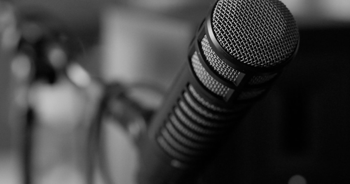 A studio microphone on a stand.